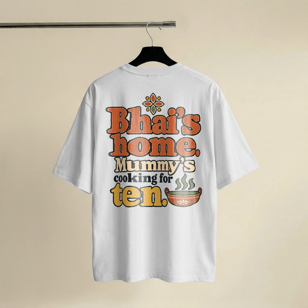 Three lines of type, the first two words large in chunky terracotta slab and the rest in charcoal serif with the final word enlarged in honey gold, a single-line sage kadhai with three steam curls beside the number and a tiny rangoli star capping the top., on a white oversized t-shirt